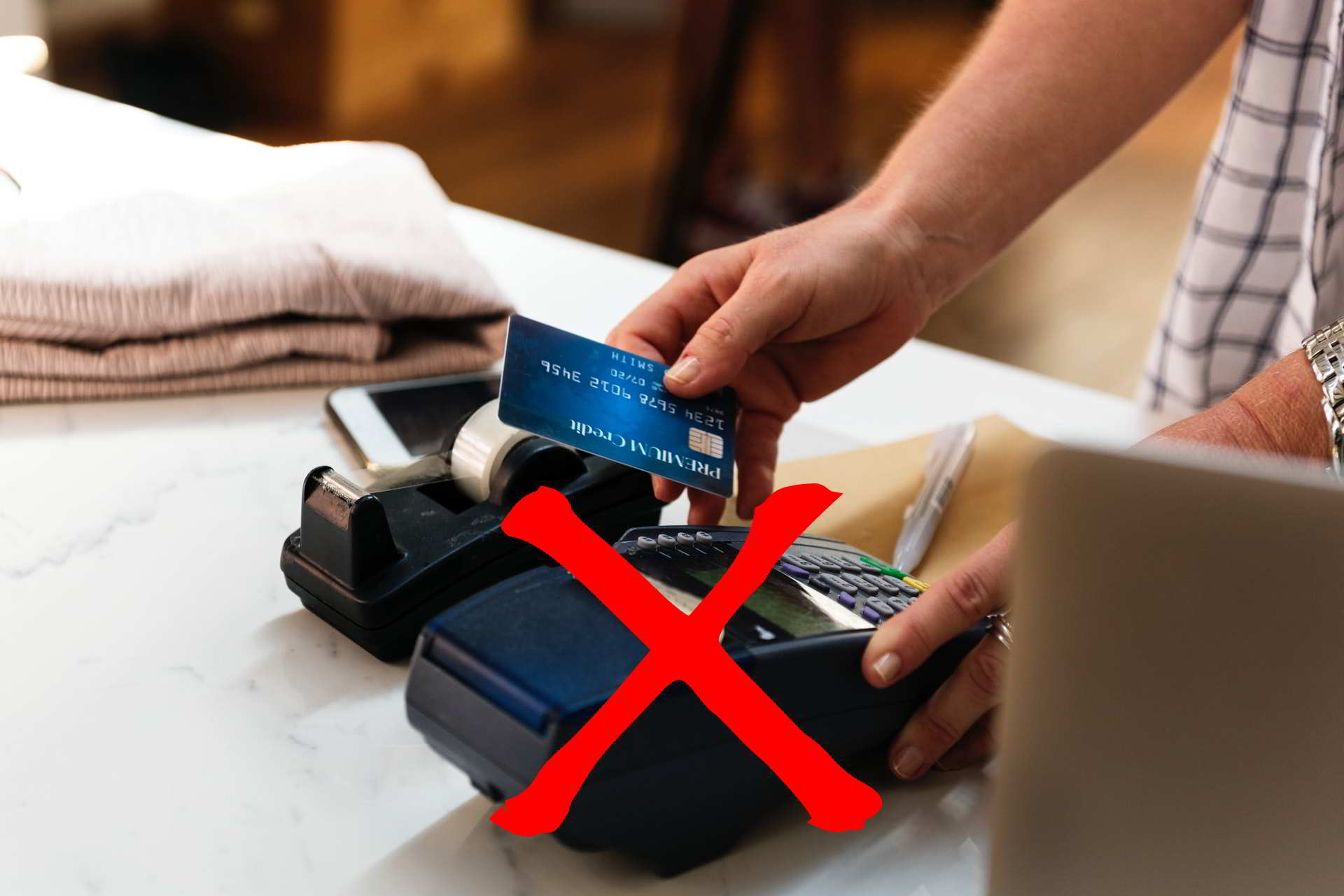 credit card payment on POS terminal scratched in red